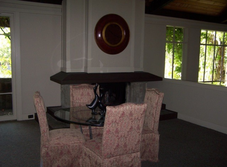 An extra room in the Main Clubhouse with chairs and a table.