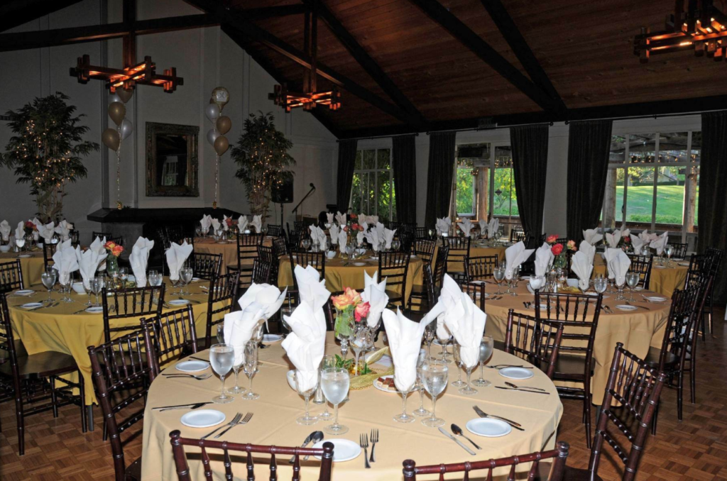 Main Clubhouse main dining hall with tables and chairs set up.